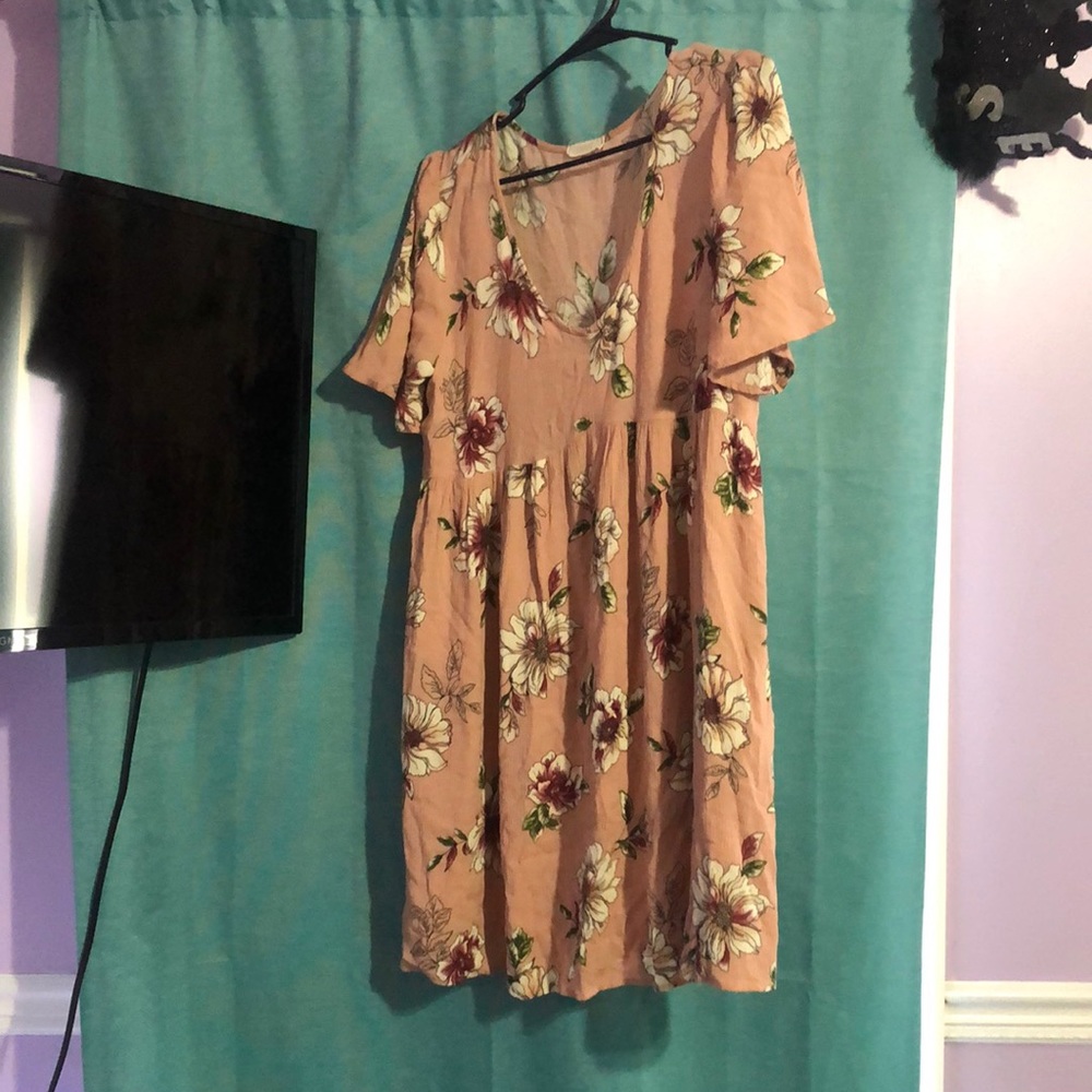 flower print tunic top,it is large but could fit a medium. The brand is Oddi!